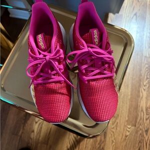 Red and pink adidas shoes